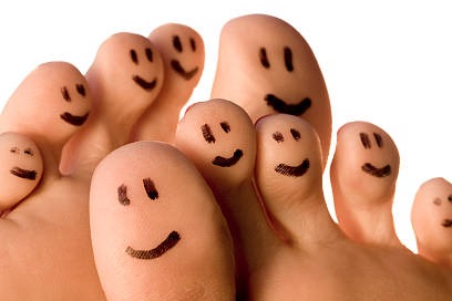 Toes with smiley faces drawn on them